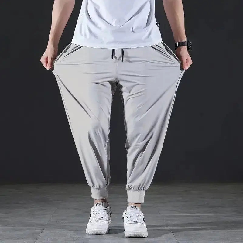 Summer Quick-drying Ice Silk Casual Pants Men's Ultra-thin Elastic Nine-point Pants Loose Drape Solid  Beam Feet Pants 7XL Suncollections