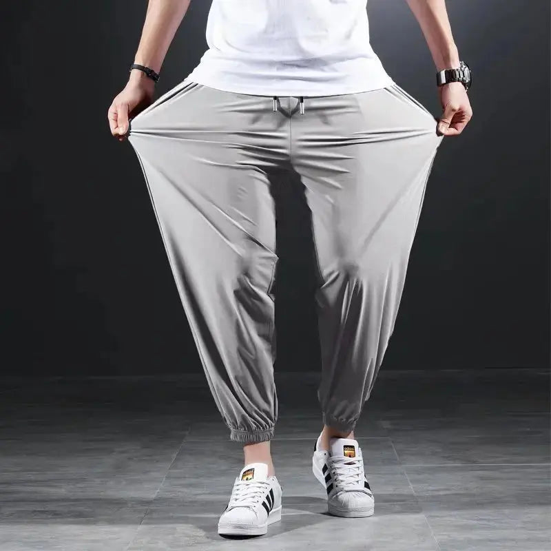 Summer Quick-drying Ice Silk Casual Pants Men's Ultra-thin Elastic Nine-point Pants Loose Drape Solid  Beam Feet Pants 7XL Suncollections